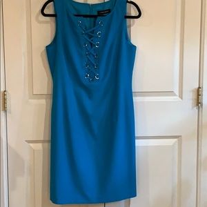 Never worn, very form fitting. Beautiful color